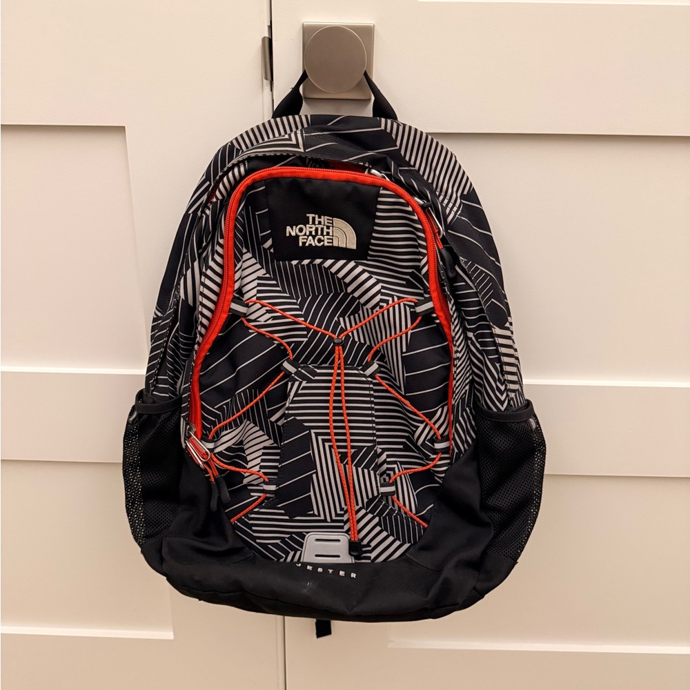 The North Face Black and White Men's Backpack with Red Accents